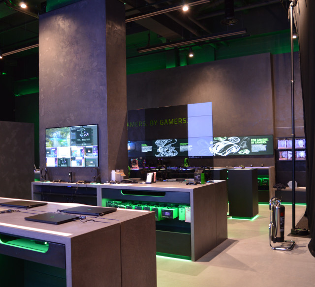 Retail-fit-out by ECSEC fit-out contractors at RazerStore London Leicester Square showcasing premium gaming PCs and peripherals on illuminated display plinths.