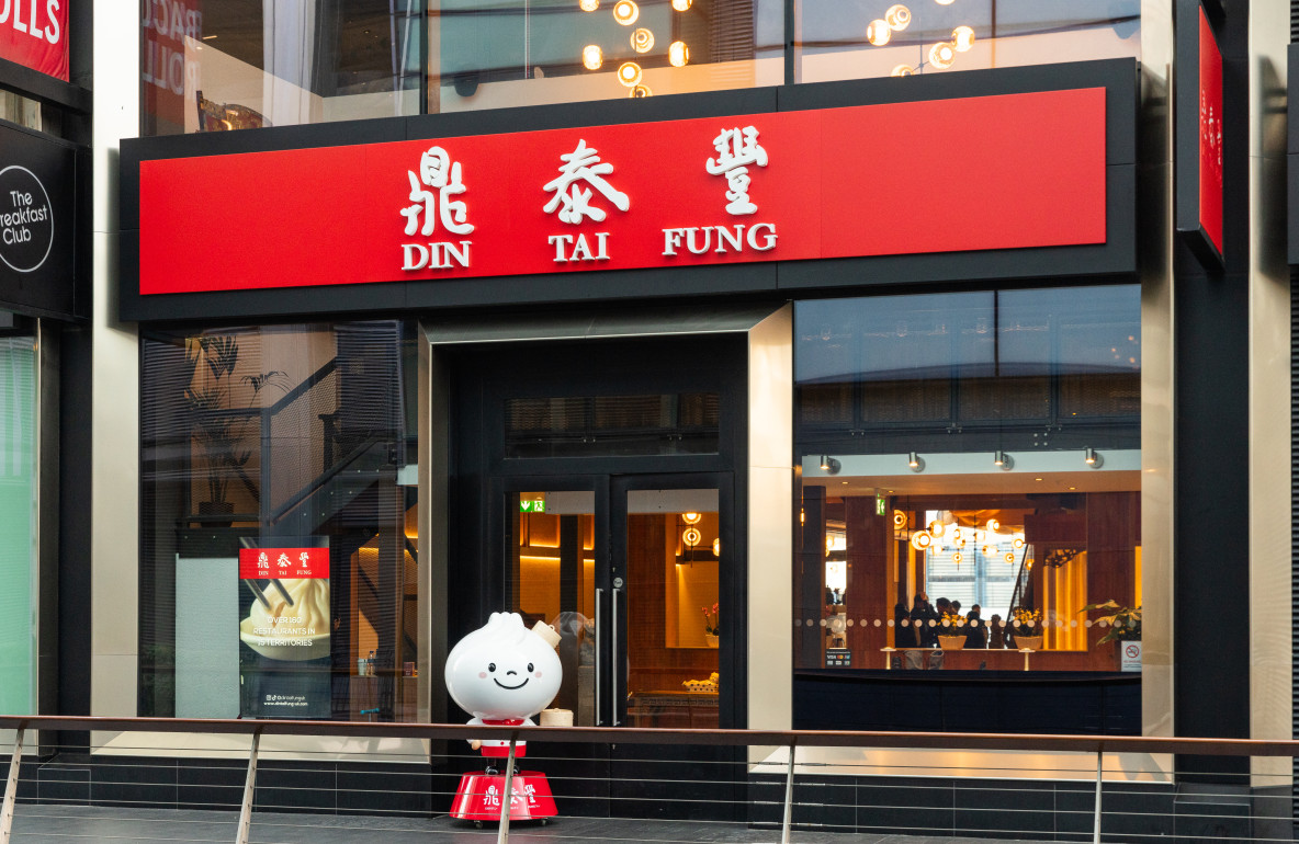 Exterior view of Din Tai Fung Canary Wharf restaurant completed by ECSEC Ltd, showcasing the modern façade and entrance detailing.